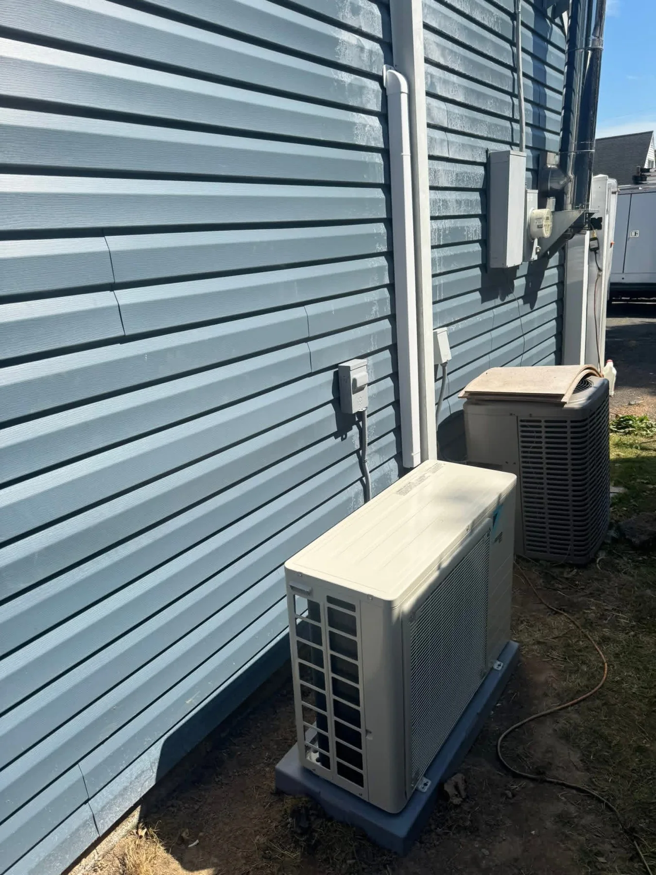 Residential HVAC equipment beside a home